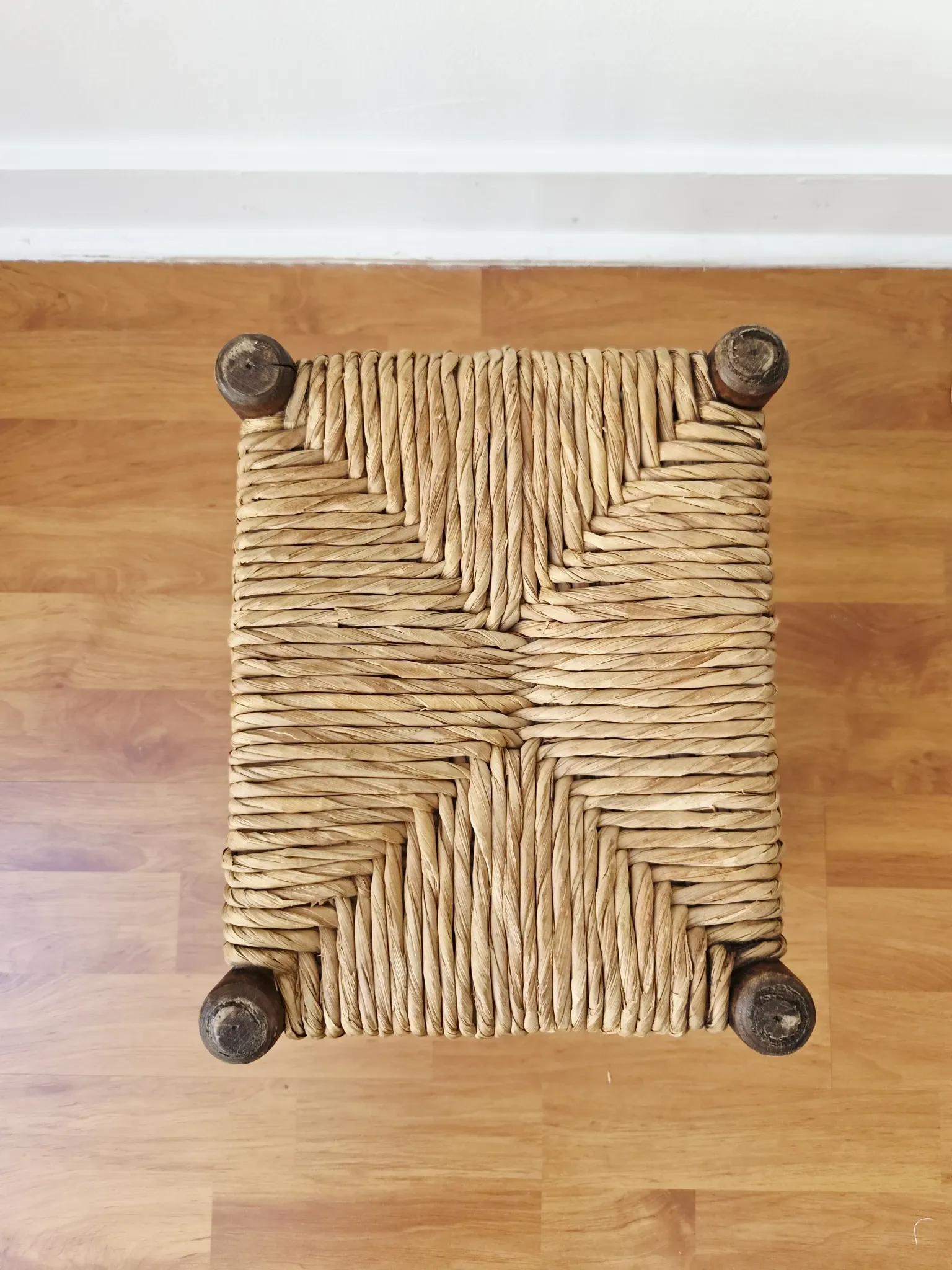 Small rustic vintage wooden and straw stool -