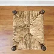 Small rustic vintage wooden and straw stool -