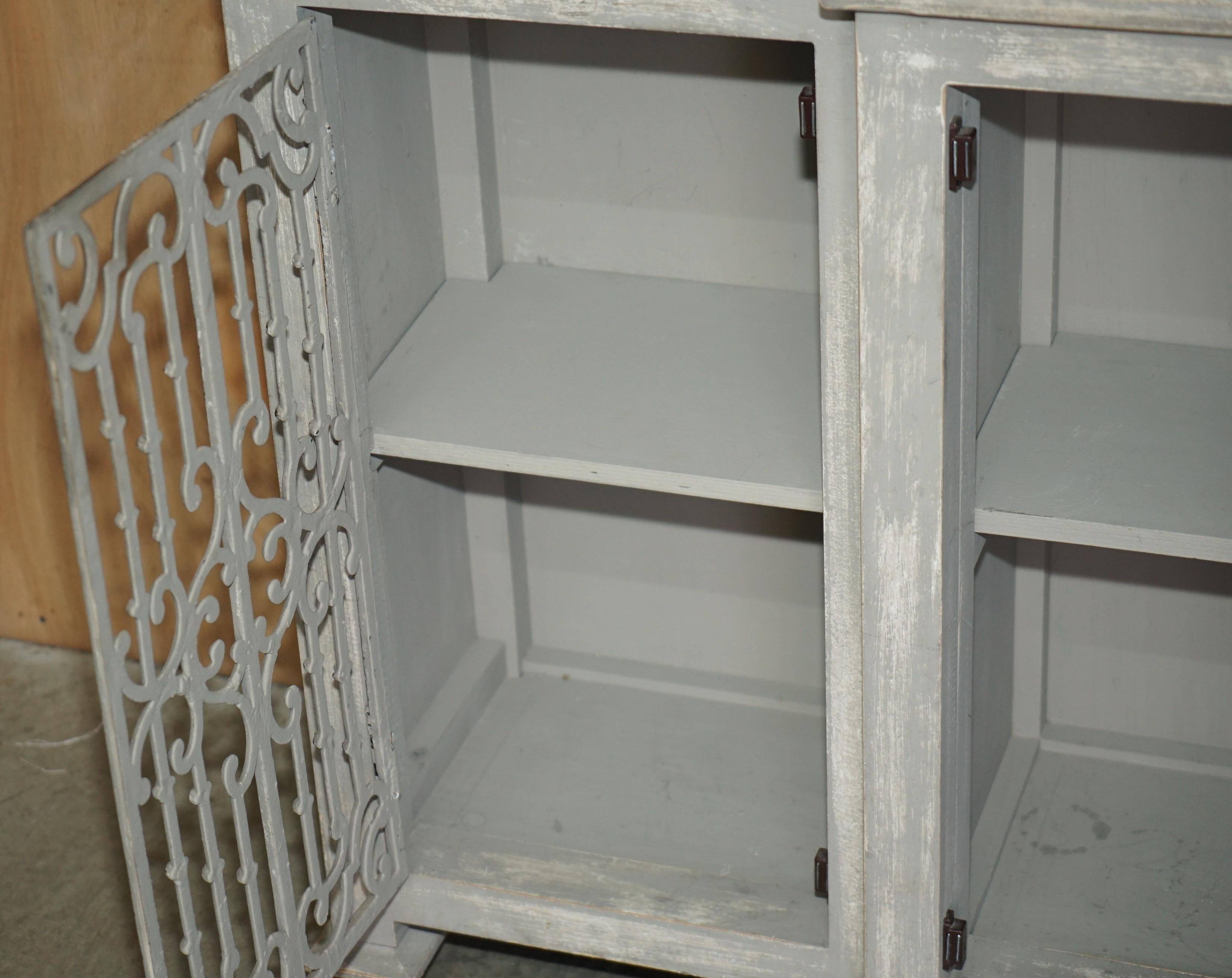 Vintage sideboard with wrought iron doors
