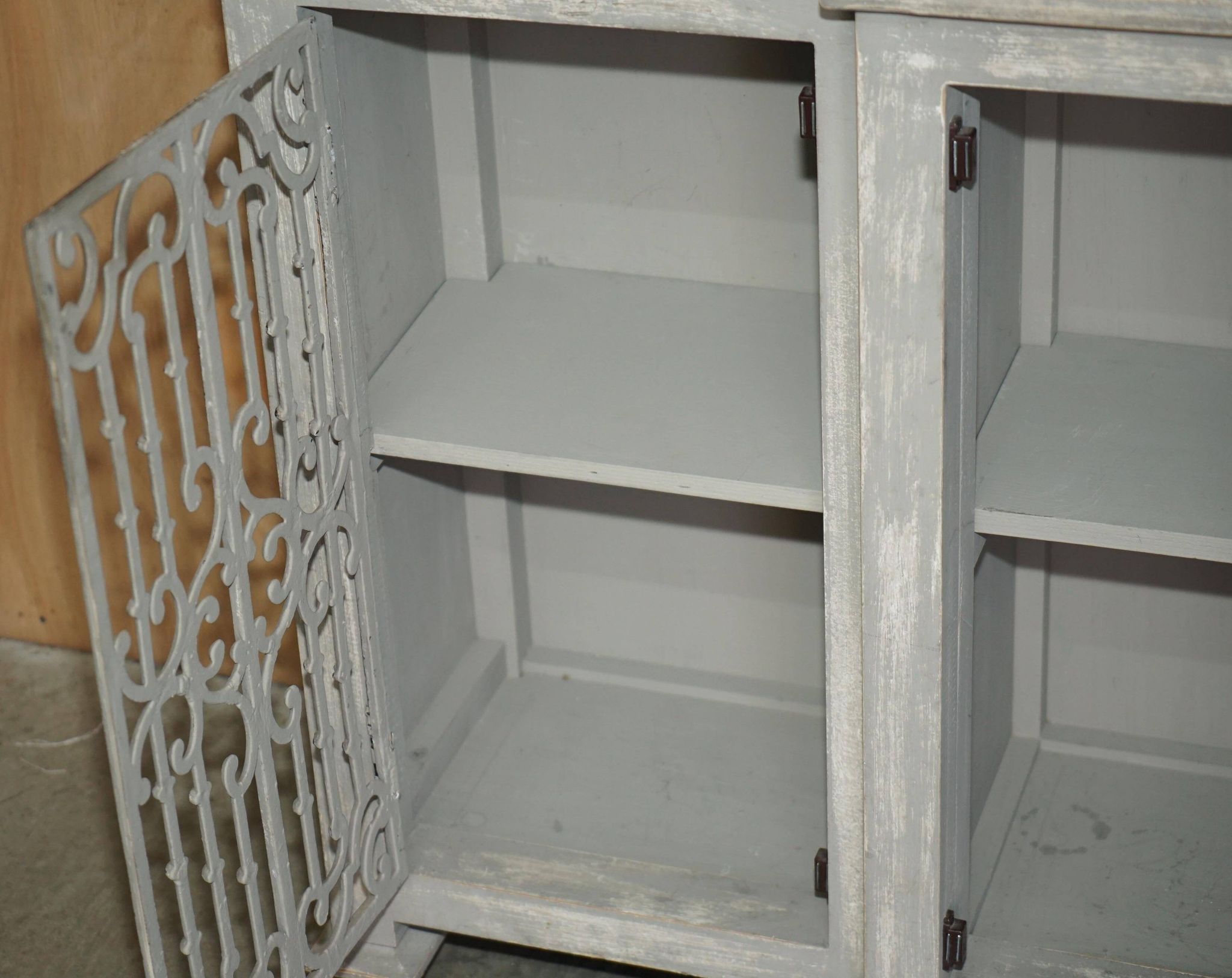 Vintage sideboard with wrought iron doors
