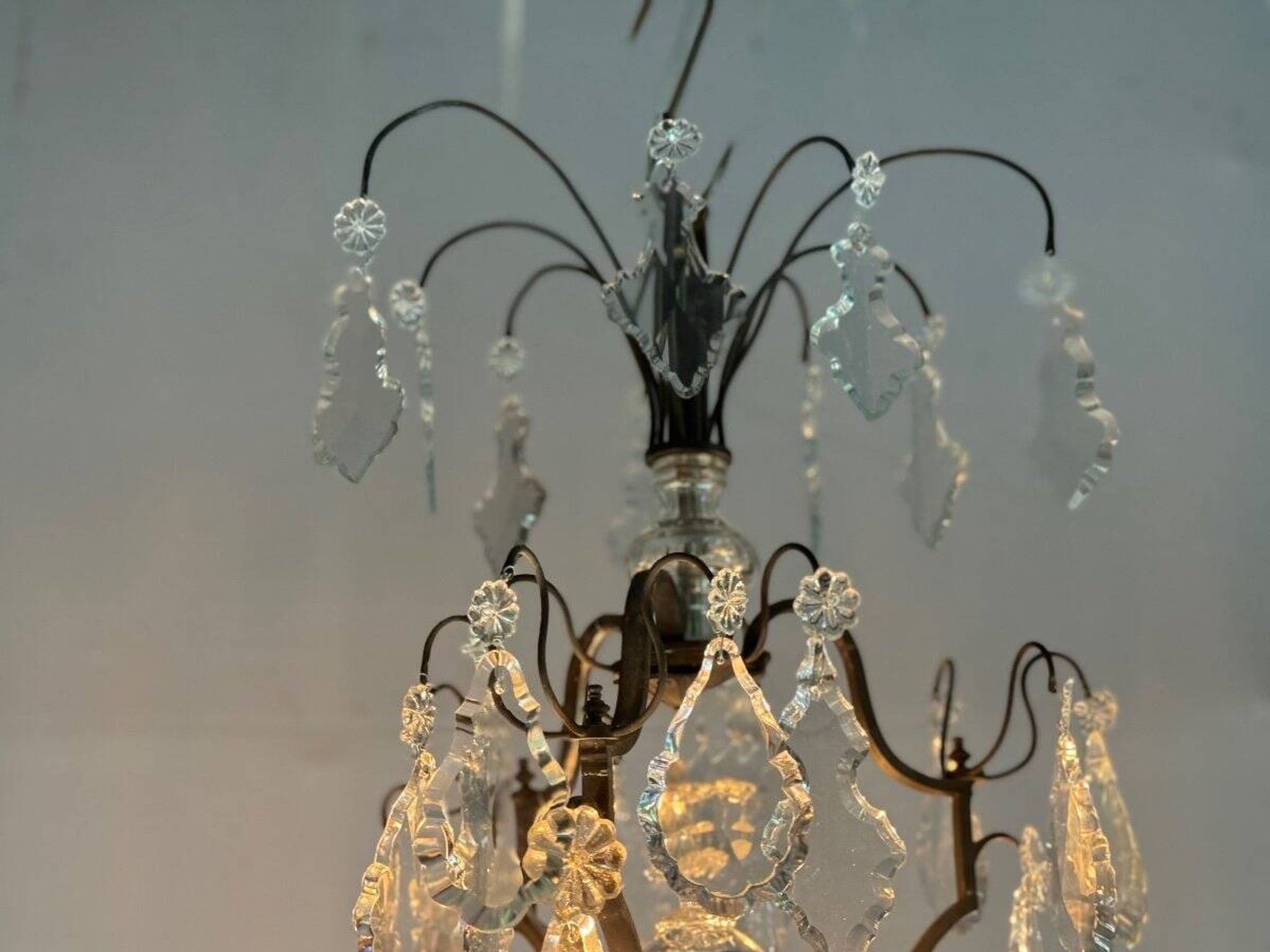 Black patinated bronze cage chandelier decorated with cut crystal pendants circa 1900
