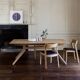 Wooden dining table with a cross extension.