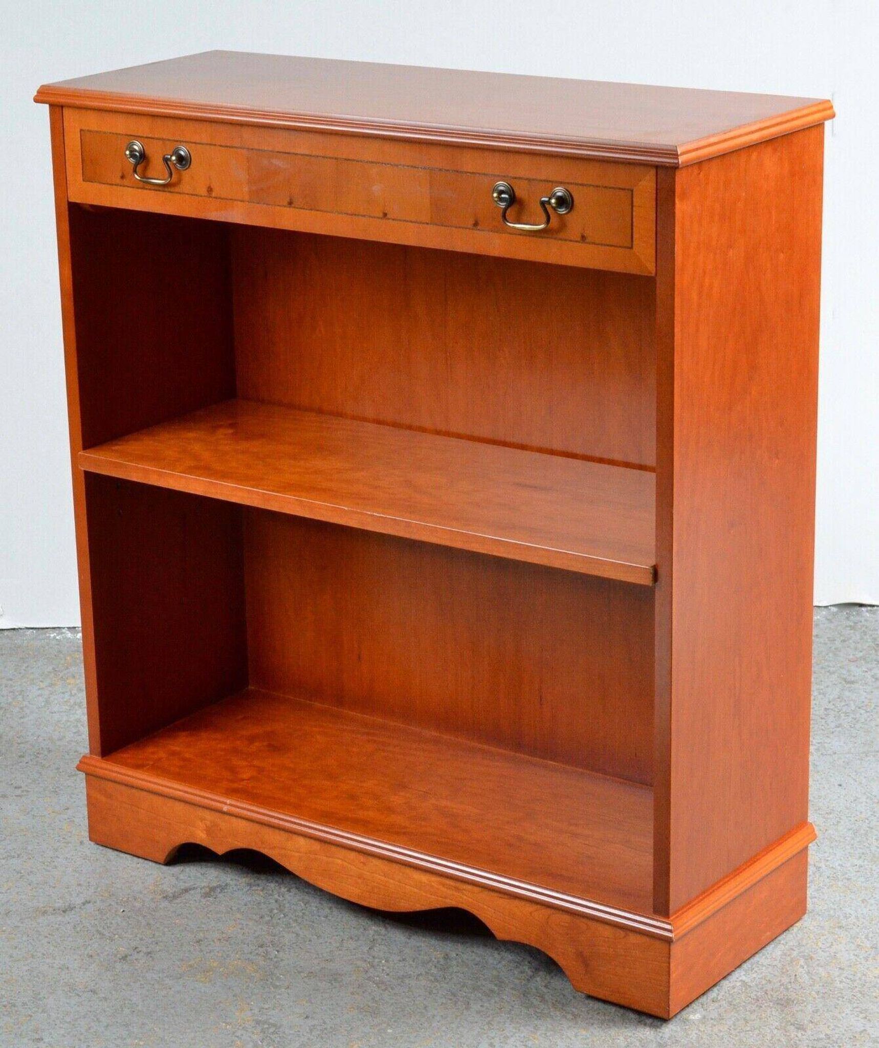 Pair of light walnut bookshelves with inlays and adjustable shelves.