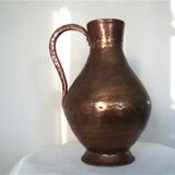 Skidded copper pitcher