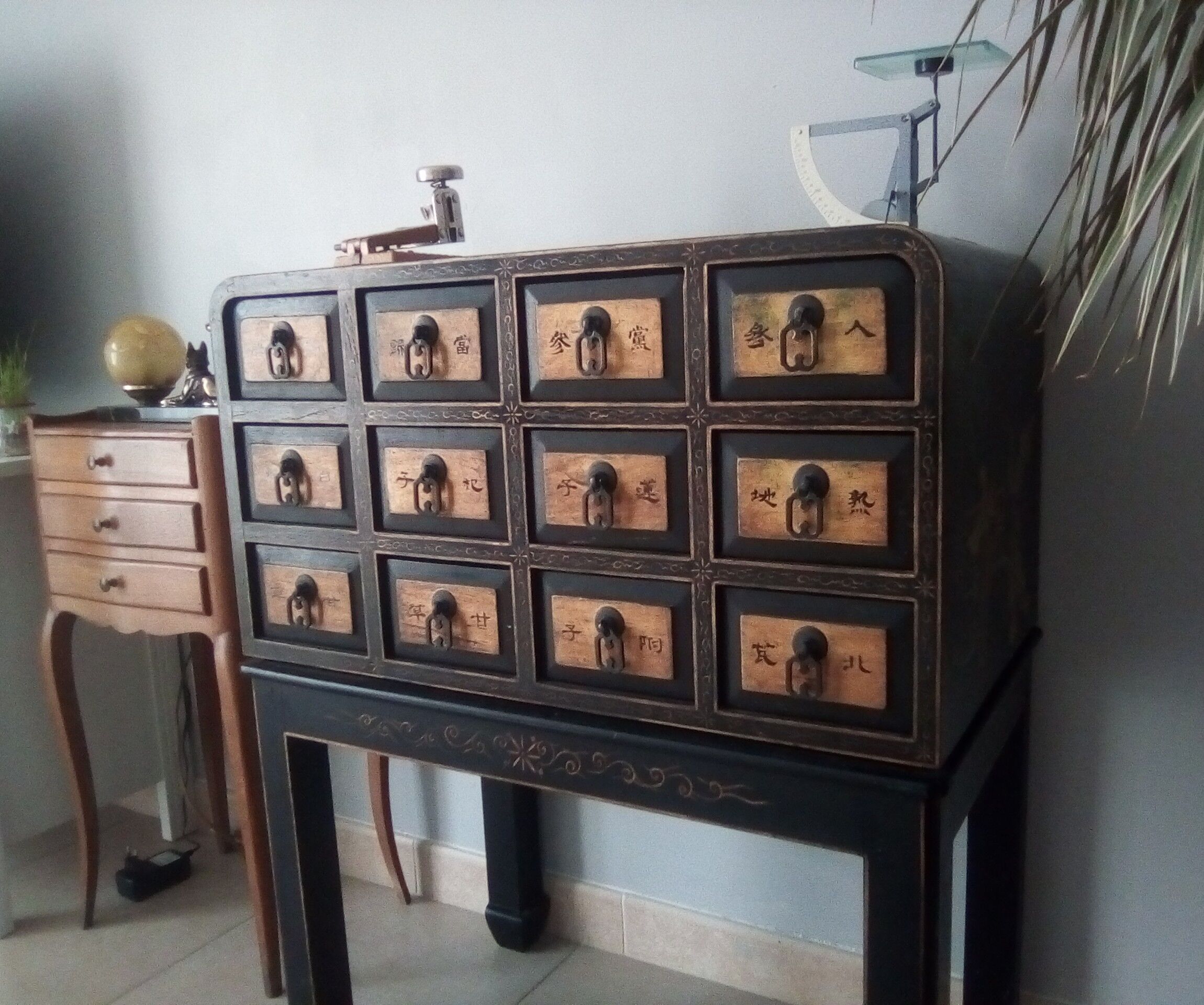 Furniture with an ancient Asian apothecary drawer