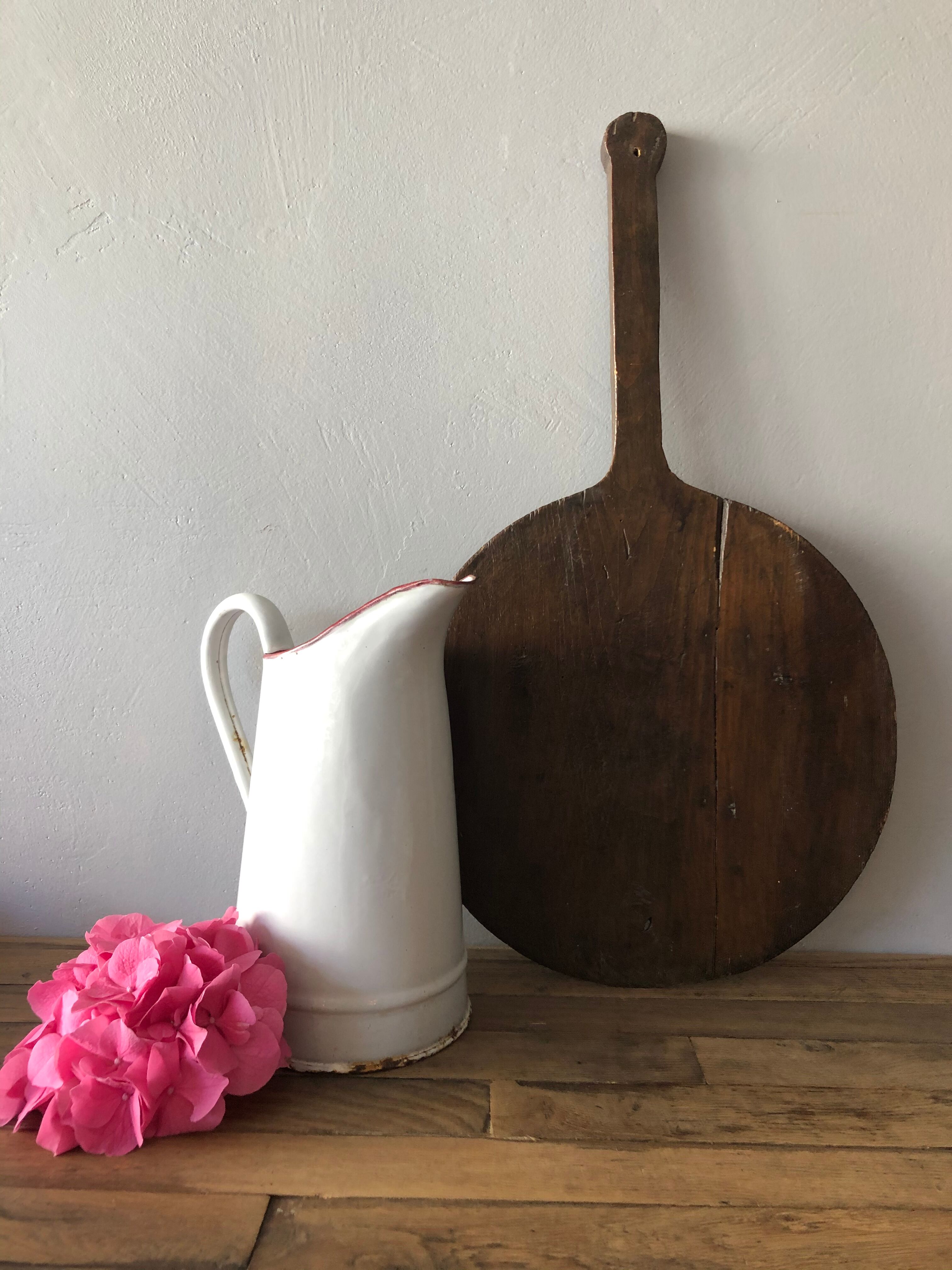 Old pitcher in enamelled sheet metal