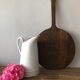 Old pitcher in enamelled sheet metal