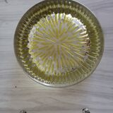 Empty round pockets of iridescent transparent glass of yellow sticks