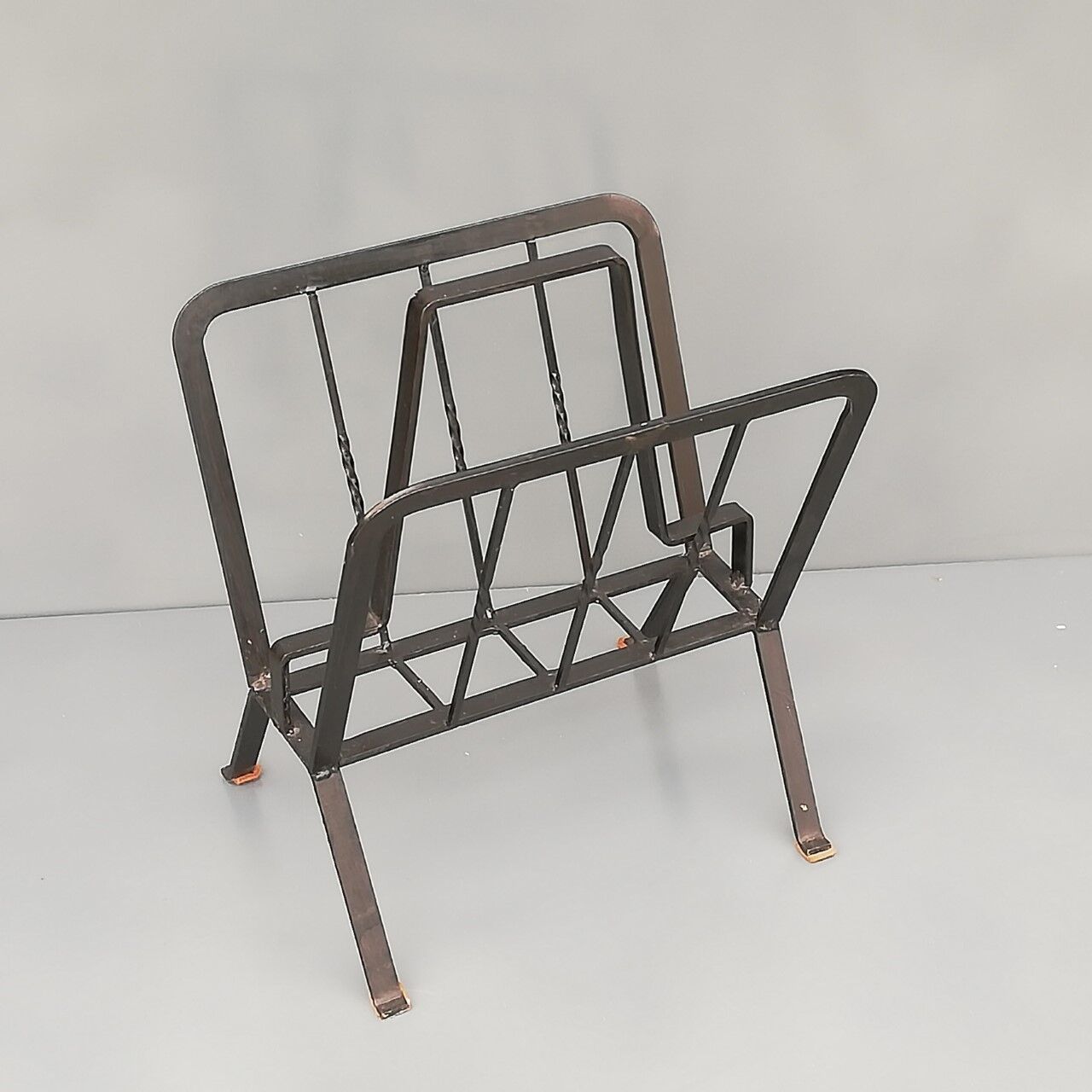 Black painted metal magazine holder