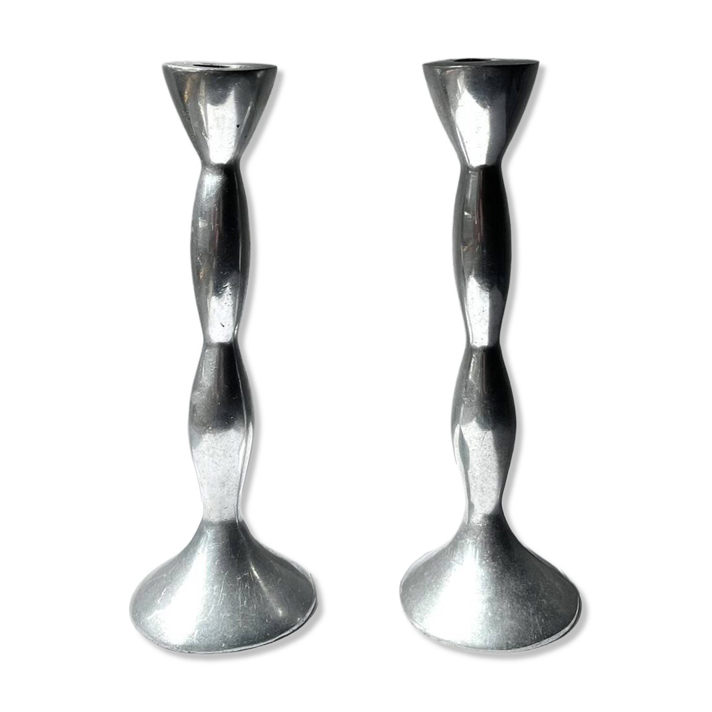 Pair of wavy aluminium candle holders