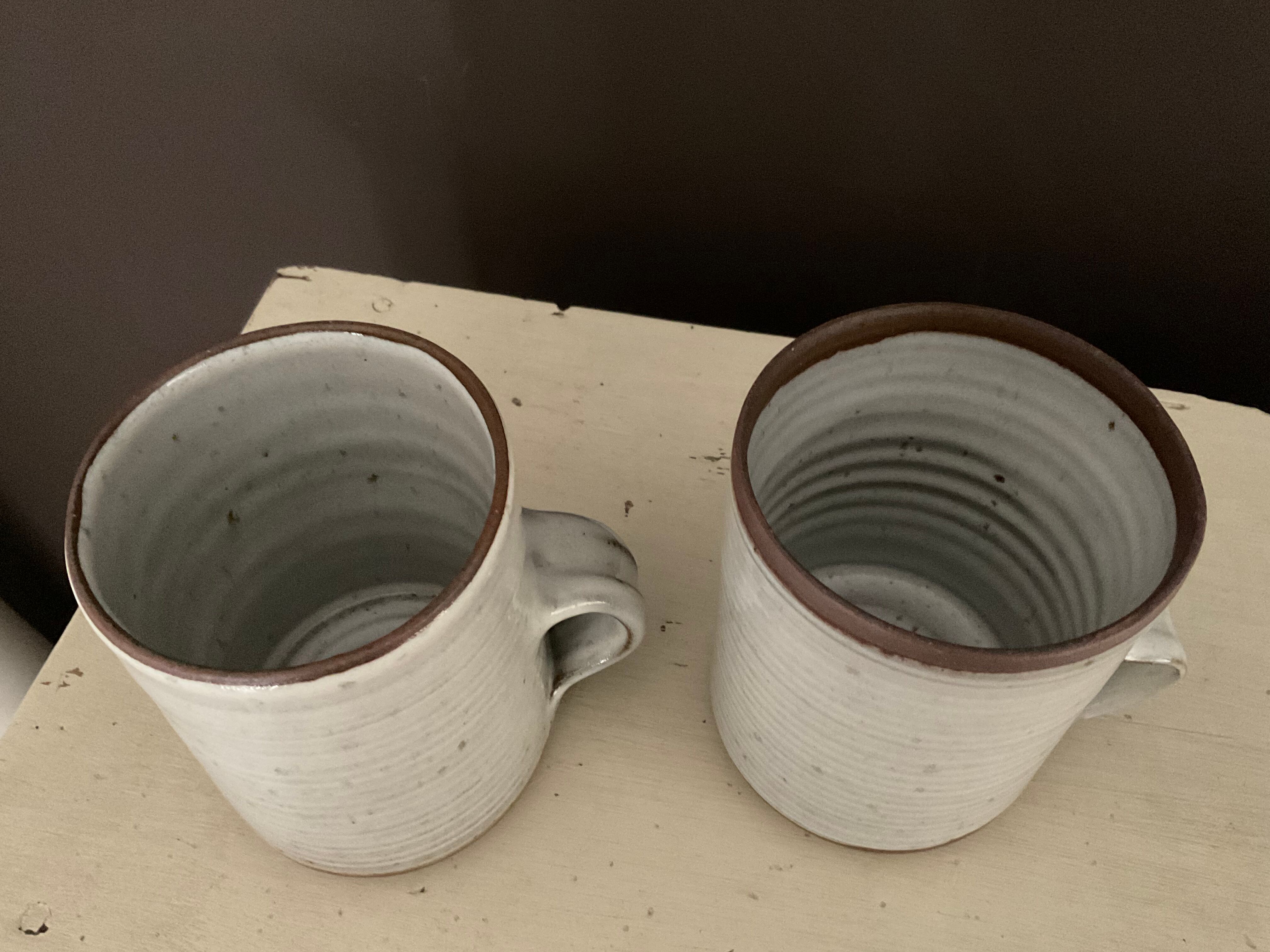 2 Mugs in Sandstone.Roger Jacques St Amand .vintage