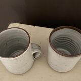 2 Mugs in Sandstone.Roger Jacques St Amand .vintage