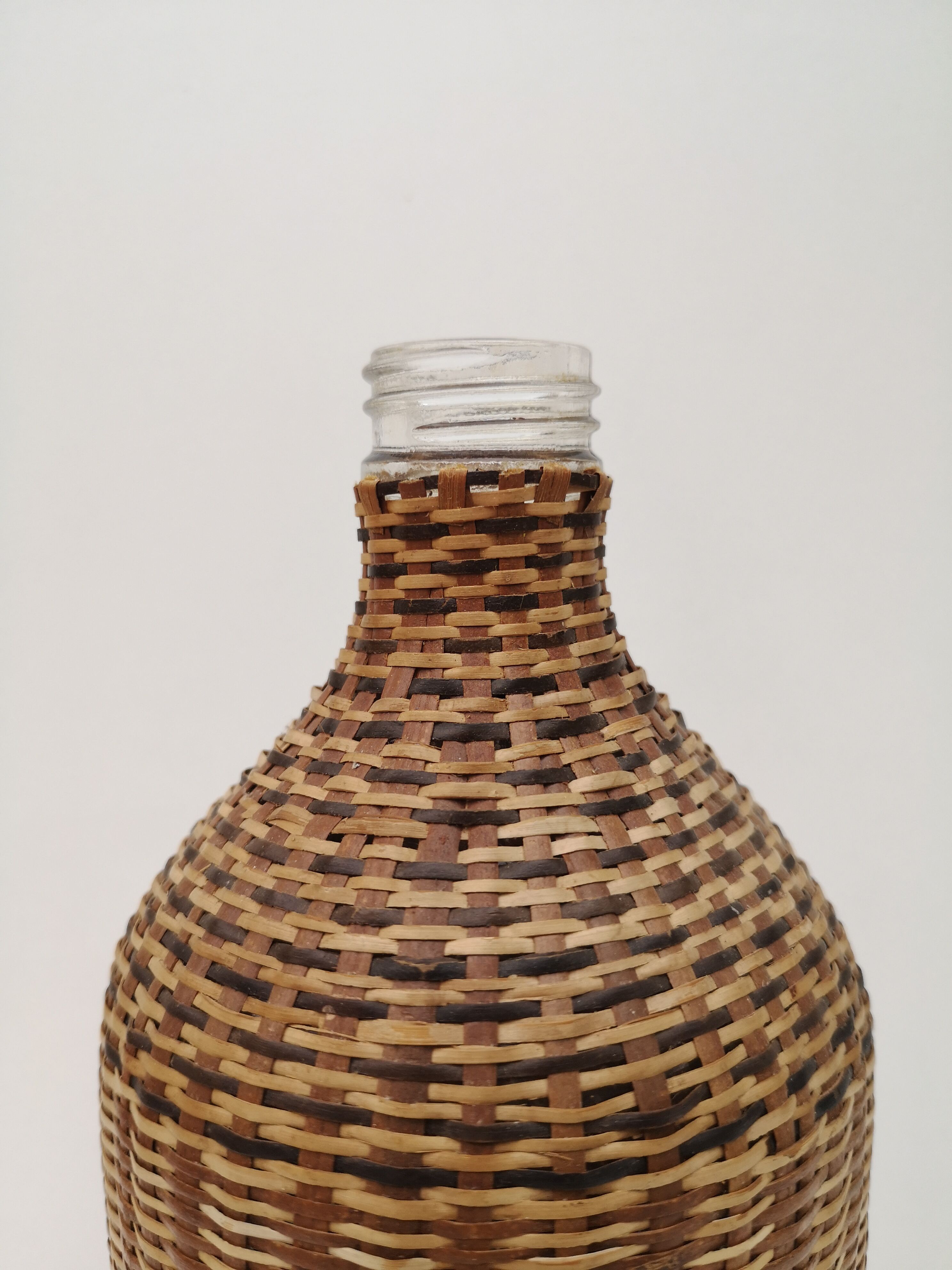 Vintage bottle in braided straw