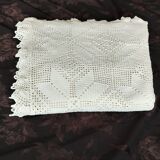 White cotton bedspread, crocheted sofa throw with star patterns