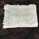 White cotton bedspread, crocheted sofa throw with star patterns