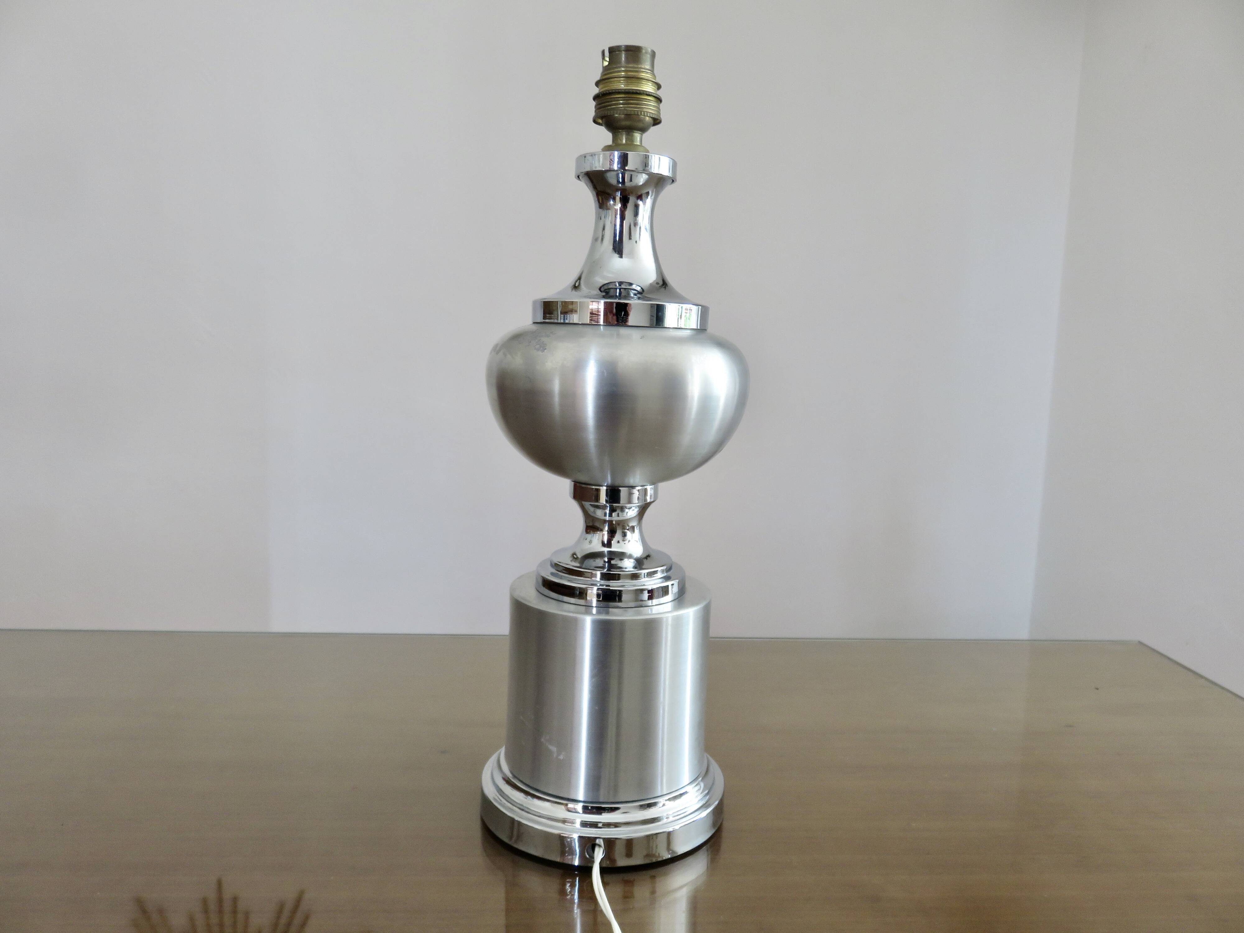 Brushed aluminum and chrome lamp typical of the 70s