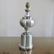 Brushed aluminum and chrome lamp typical of the 70s