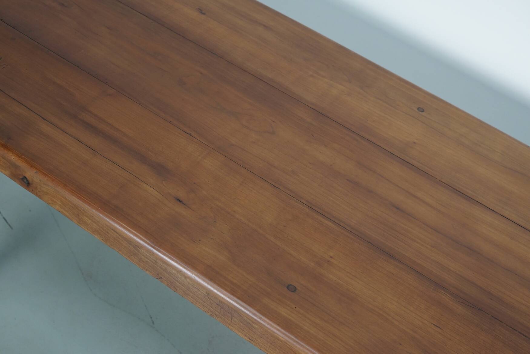 Rustic dining table in fruitwood from the early 20th century