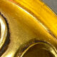 Small corner console in resin with a gold finish.