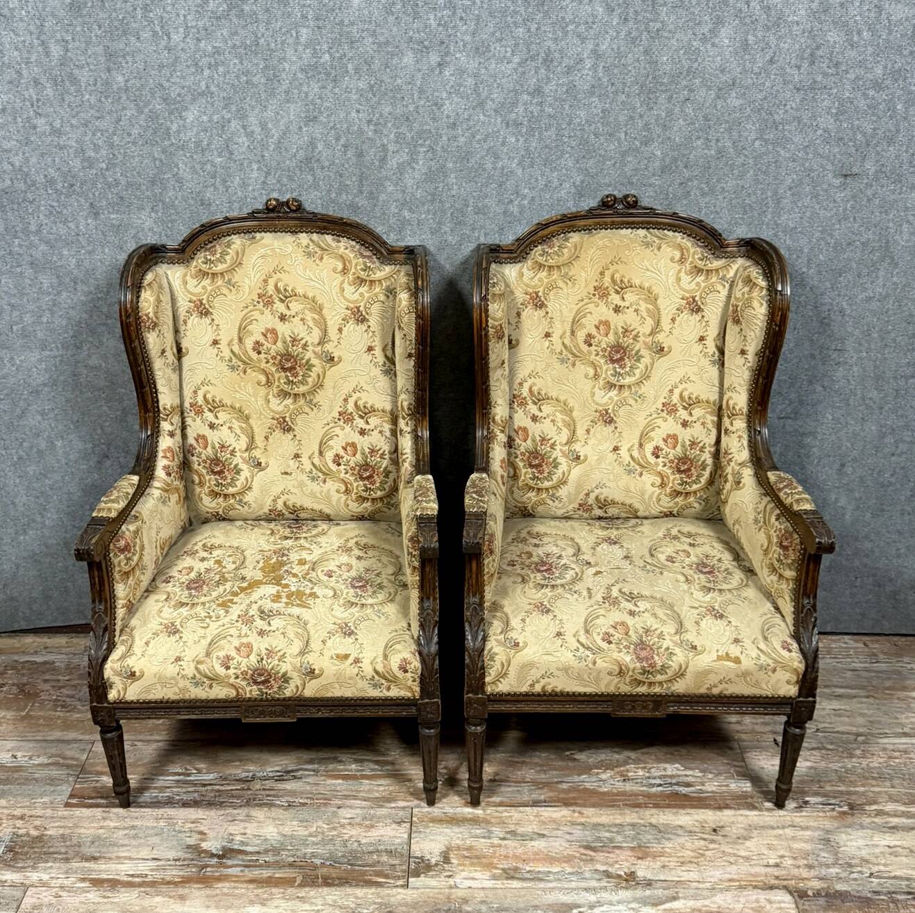 Large pair of Louis XVI style carved wooden wingback armchairs