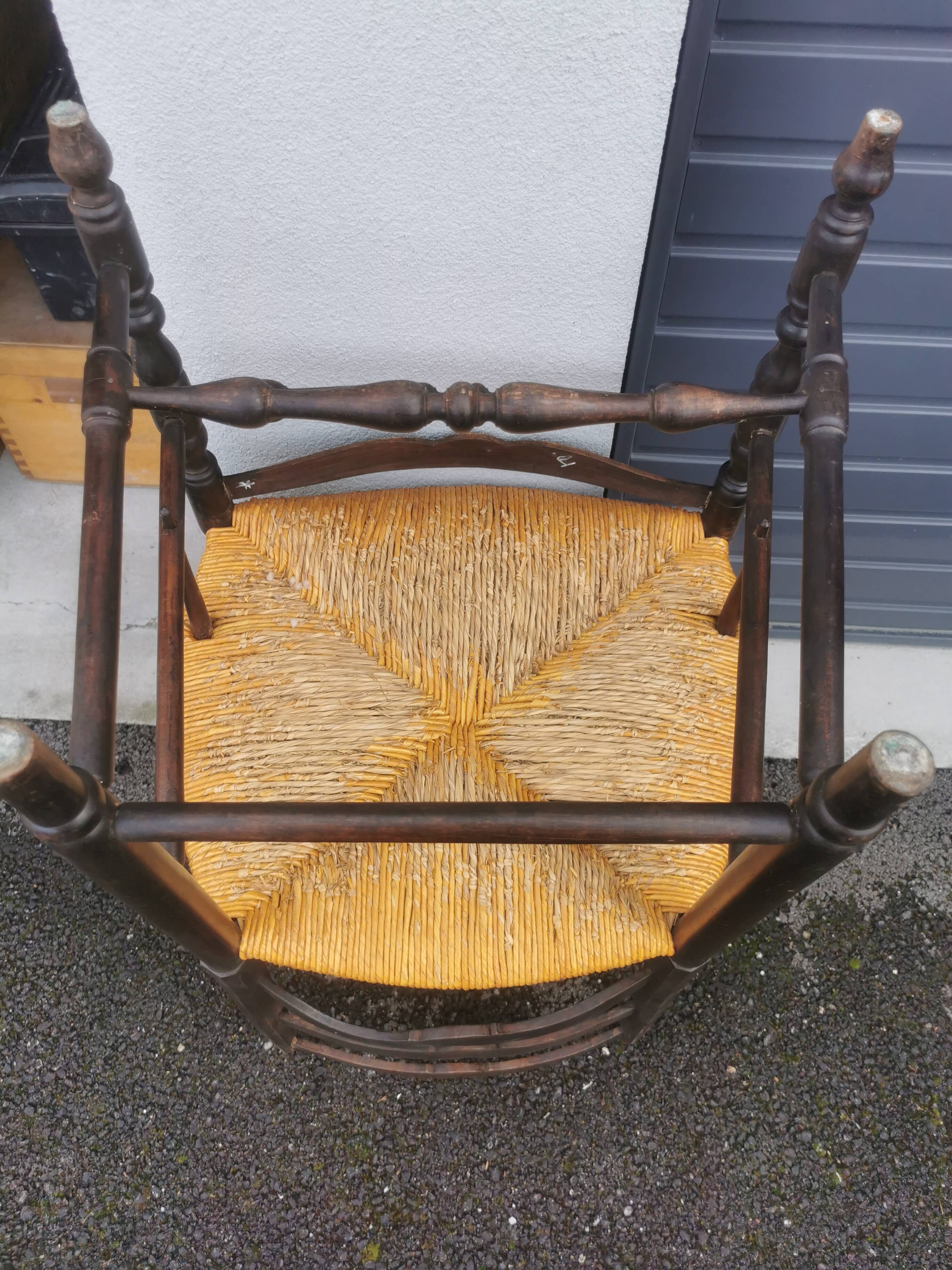 Pair of blackened wooden armchairs