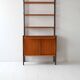 Vintage Scandinavian bookcase with pull-out desk and brass supports