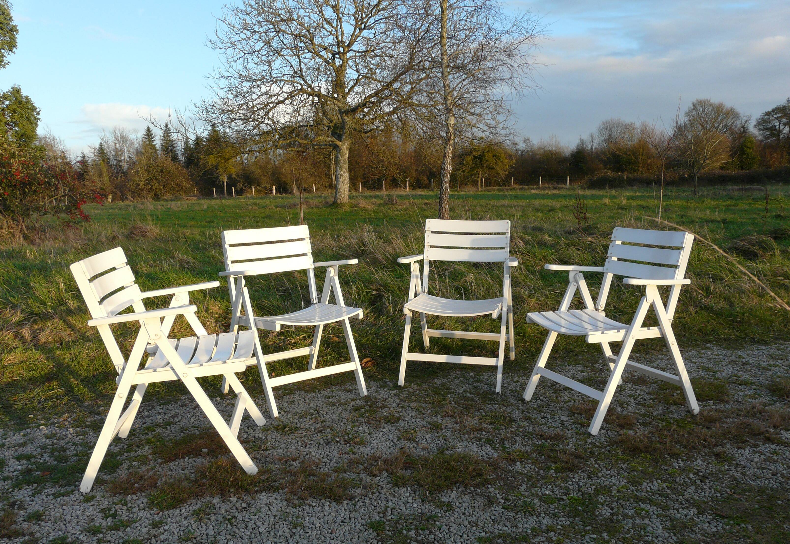 Four vintage wooden garden armchairs from the 1950s