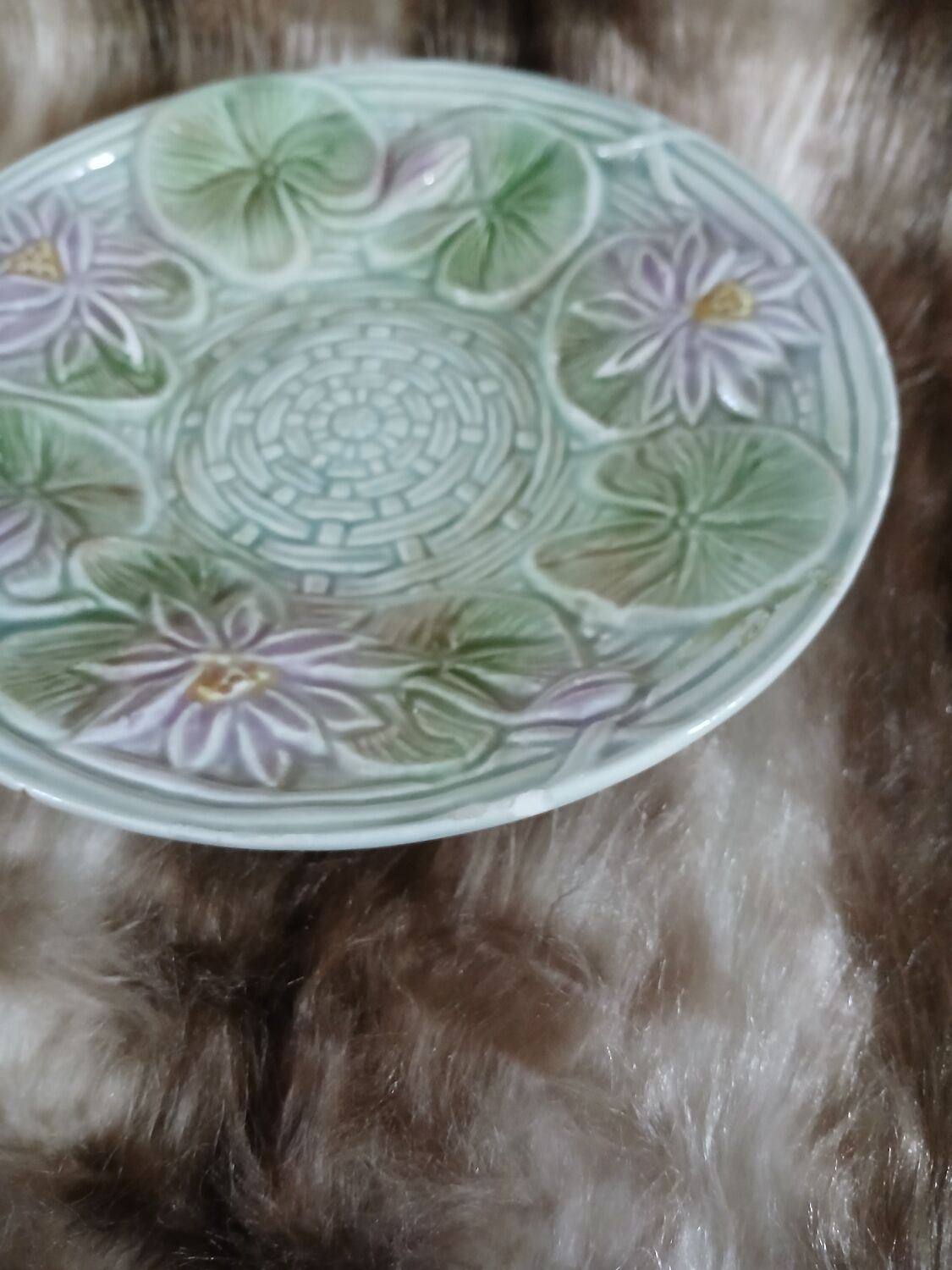 Antique cup and saucer in majolica.