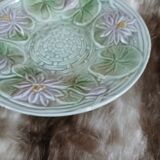 Antique cup and saucer in majolica.