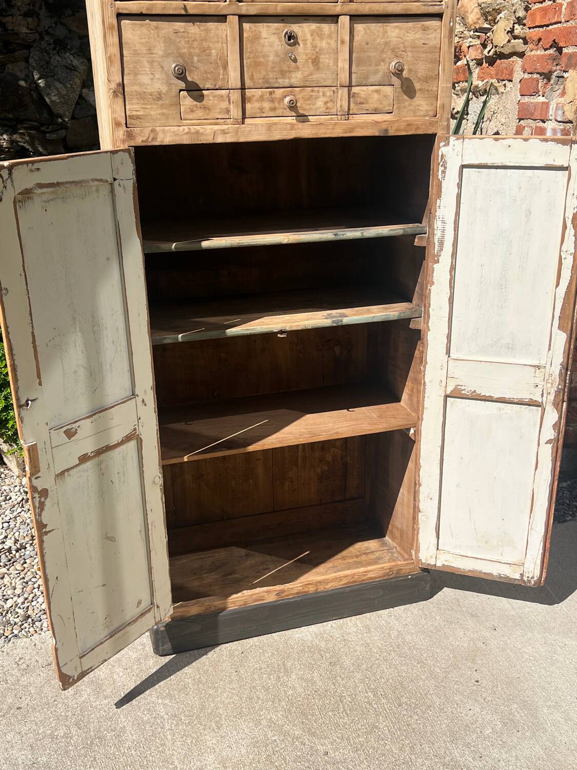 Beautiful piece of furniture with 8 drawers/2 doors in raw wood.