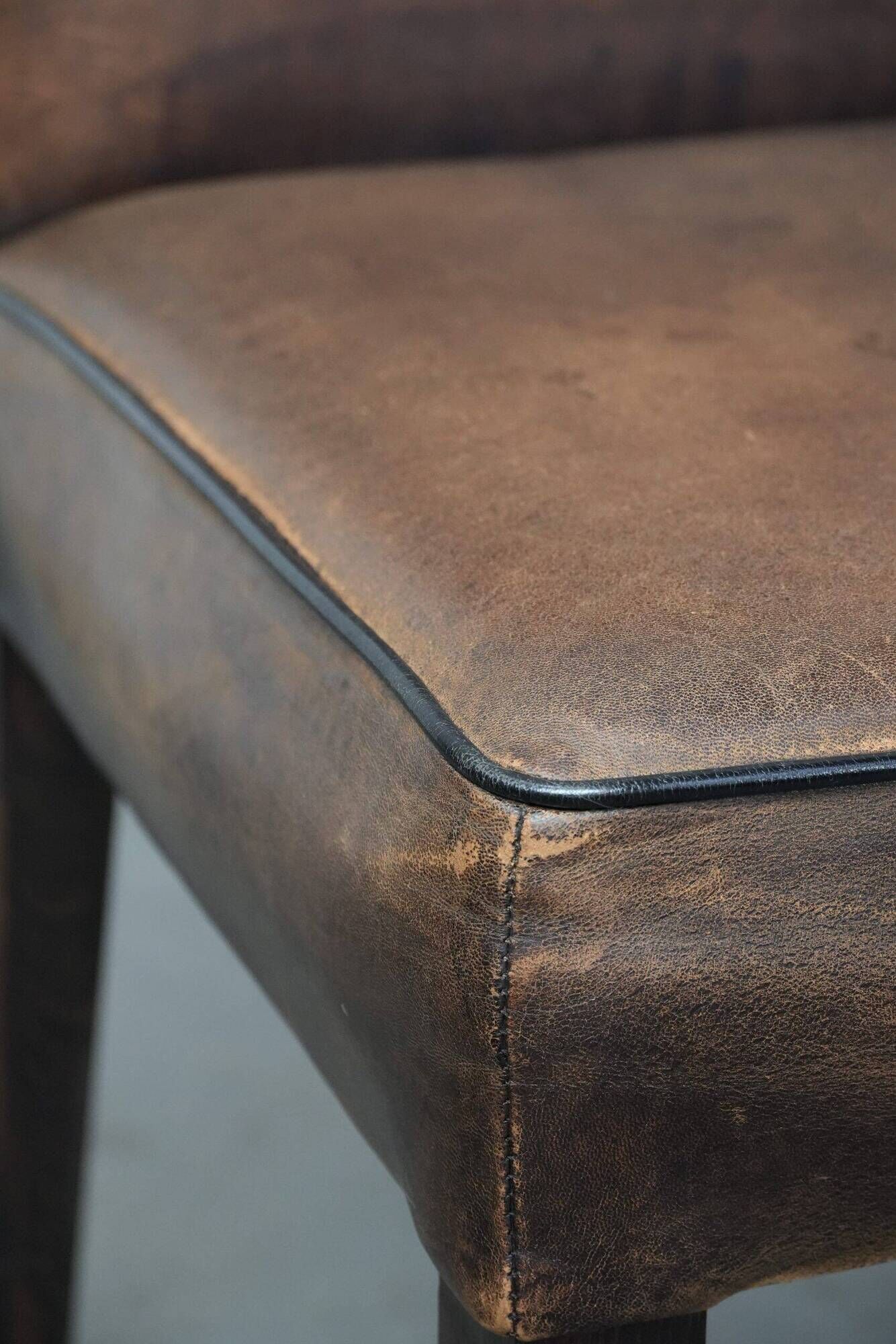 Set of 6 vintage sheepskin dining chairs finished with black piping
