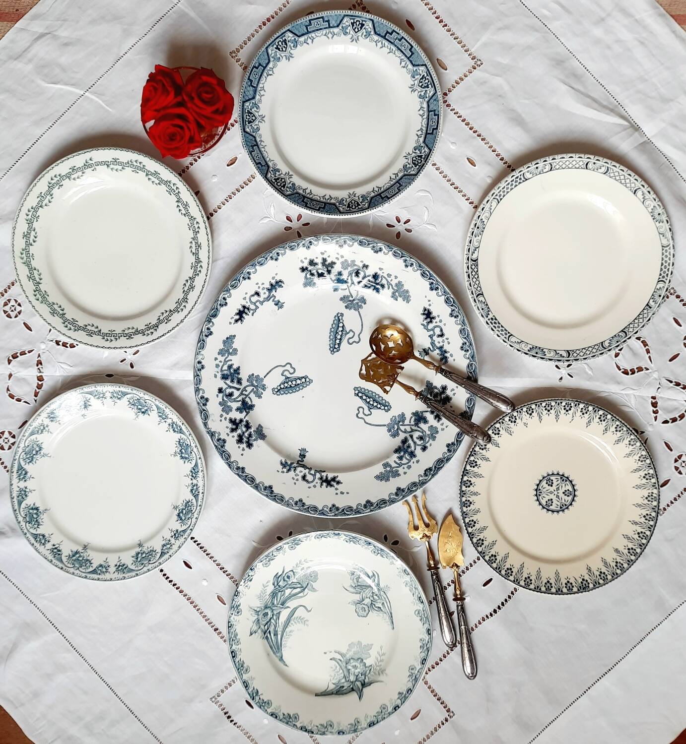 Old mismatched iron earthenware dessert plates accompanied by a dish