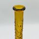 Set of two vintage textured amber glass Empoli bottles.