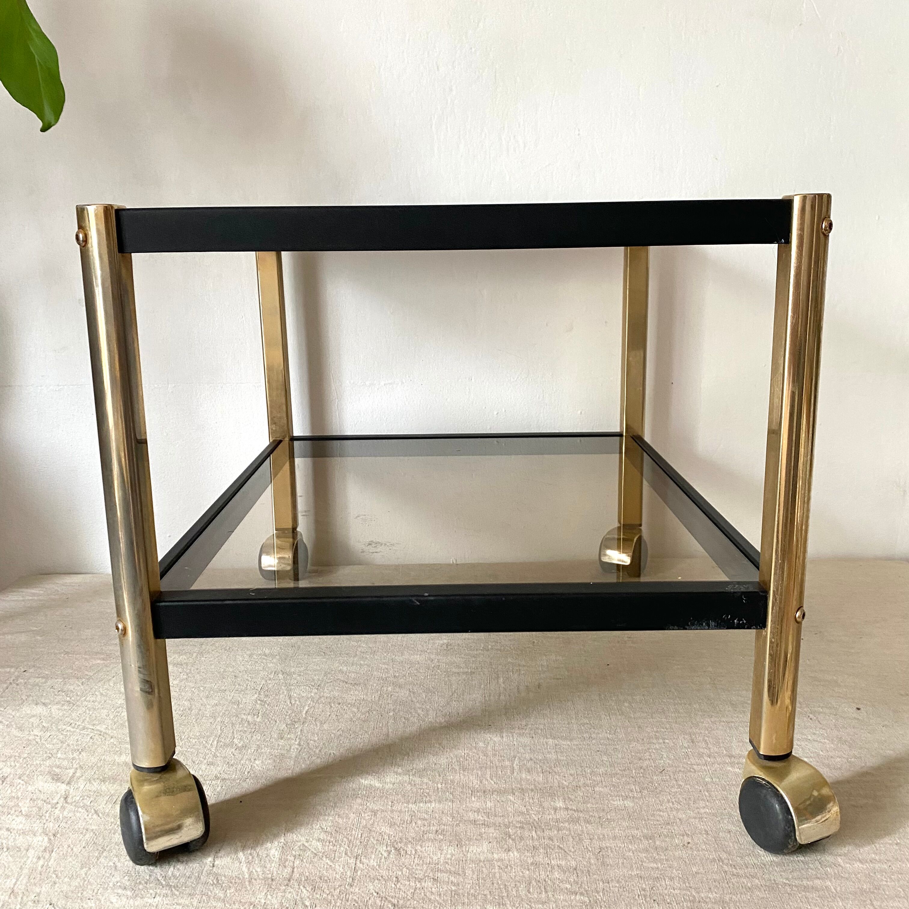 Serving with vintage wheels in metal and smoked glass