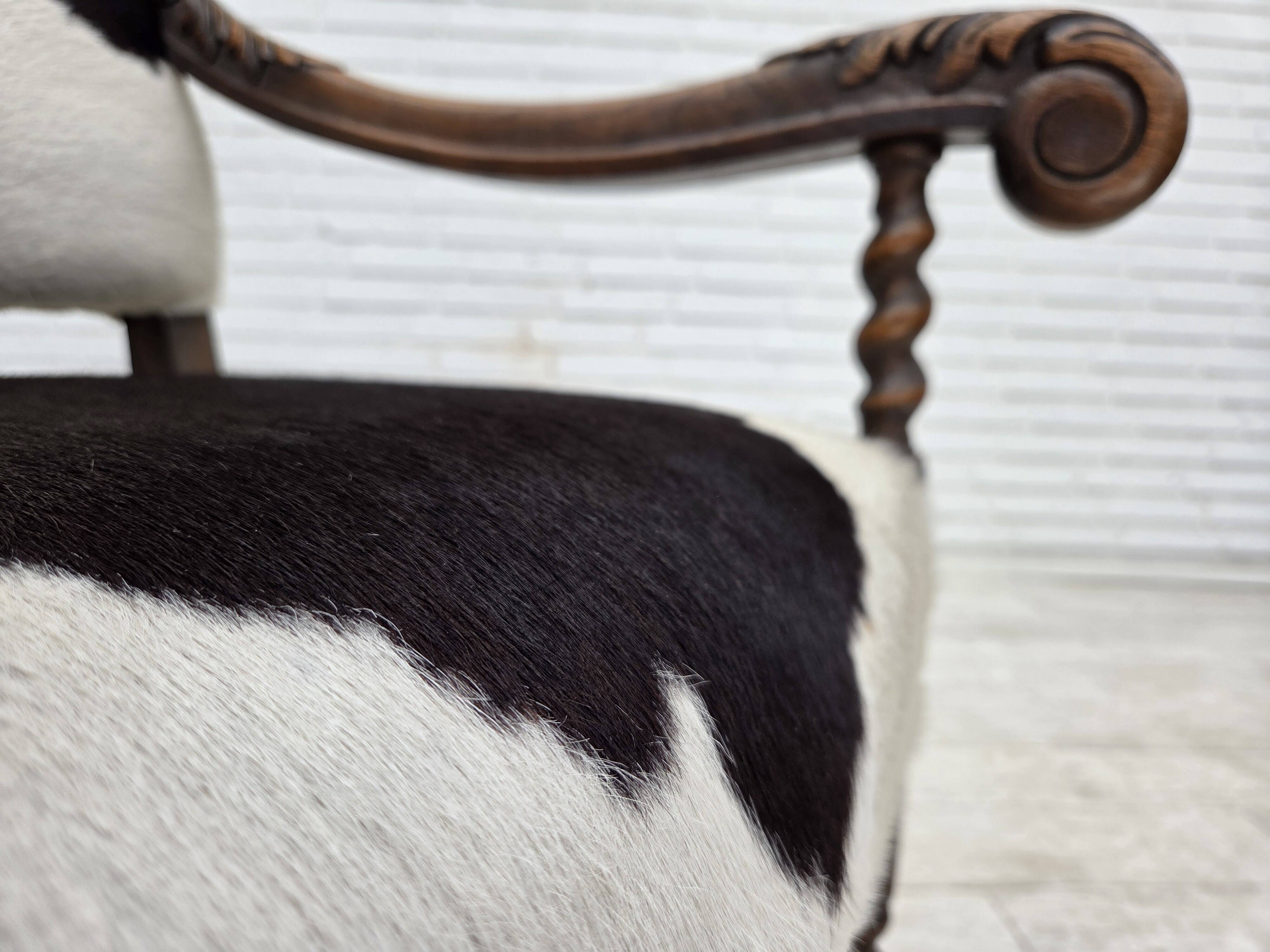1950s, Danish highback armchair, genuine cowhide, oak wood.