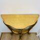 Golden console in Louis XV Rococo style made of resin.