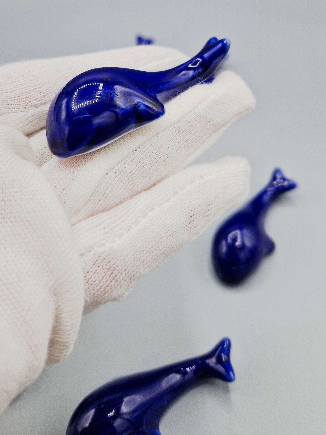 Set of 6 vintage blue porcelain whale knife rests.