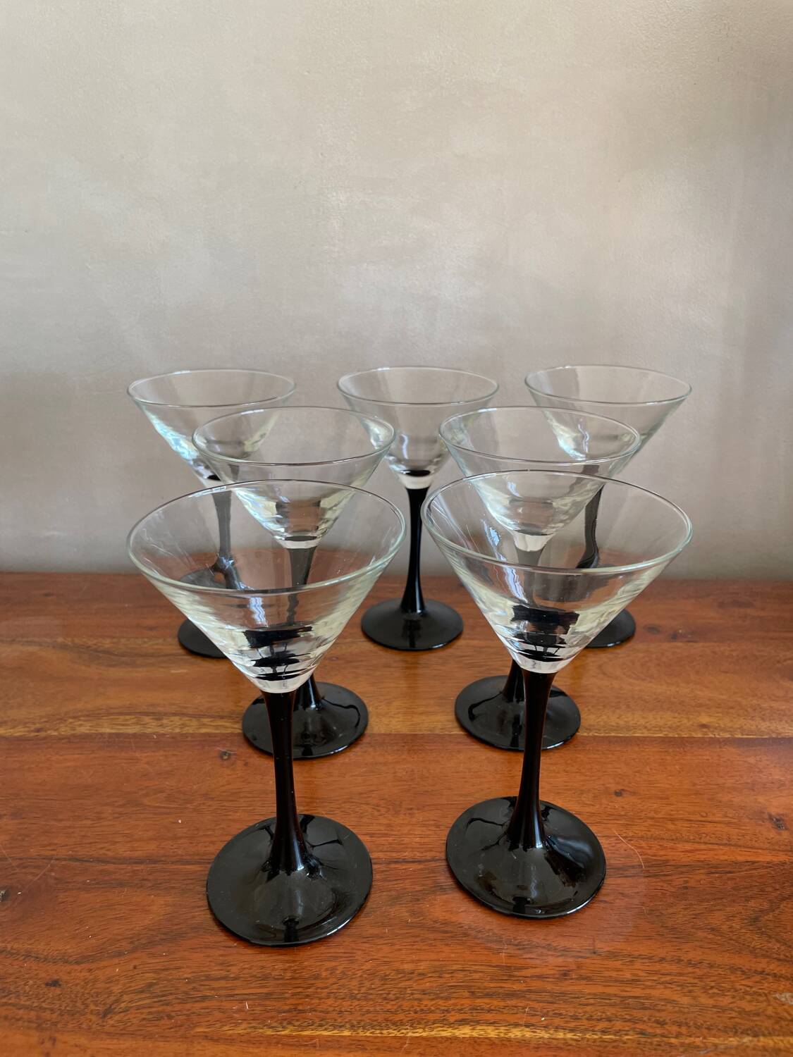 7 thin black stemmed glasses