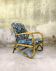 Fauteuil vintage en rotin et tissu à fleurs