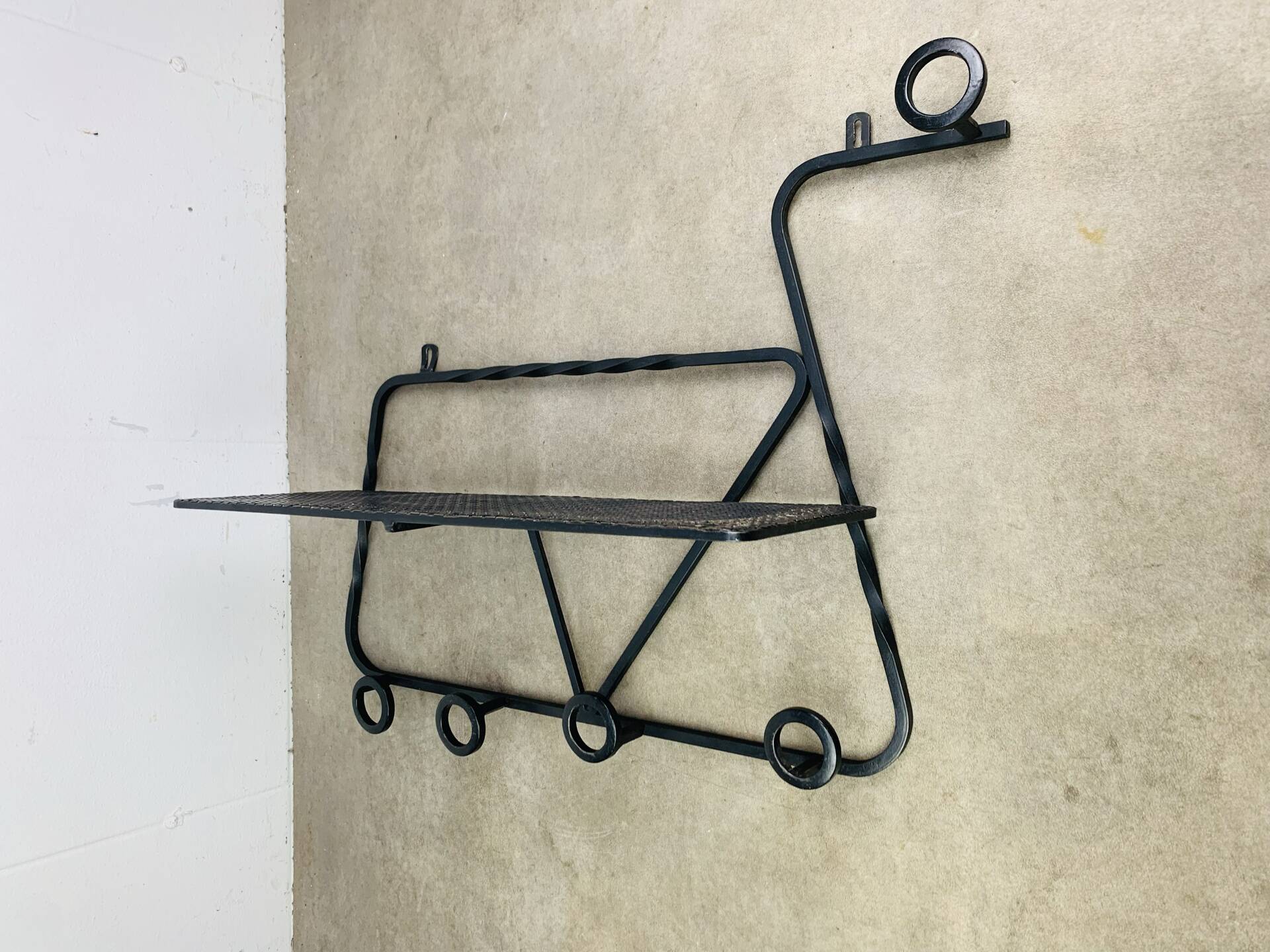 Wall-mounted coat rack/wardrobe from the 1950s, wrought iron and rigidule.
