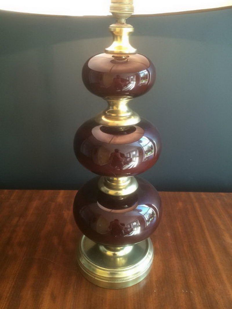 Lamp made of brass and red colored glass