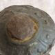 Old child's toy. Horse with bronze wheels. Ethnic object.