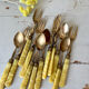 Brass and bakelite dessert cutlery
