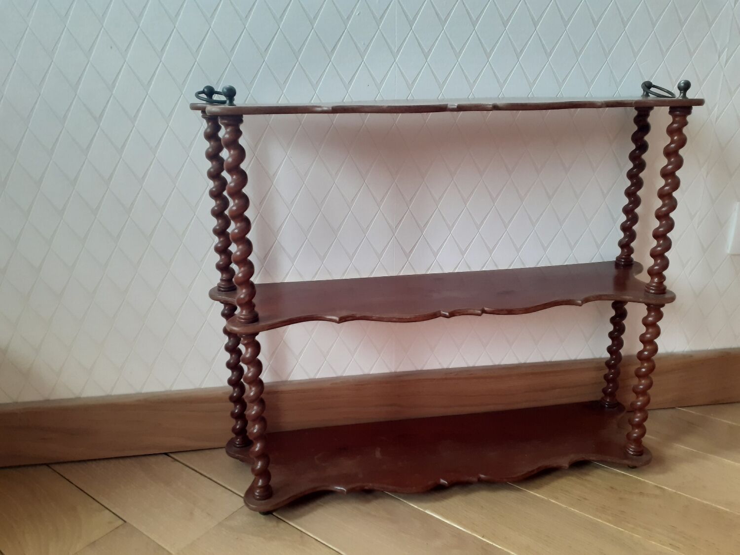 Turned wooden wall shelf