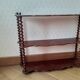 Turned wooden wall shelf