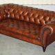 Pair of Early Victorian leather Chesterfield sofas by George Smith.