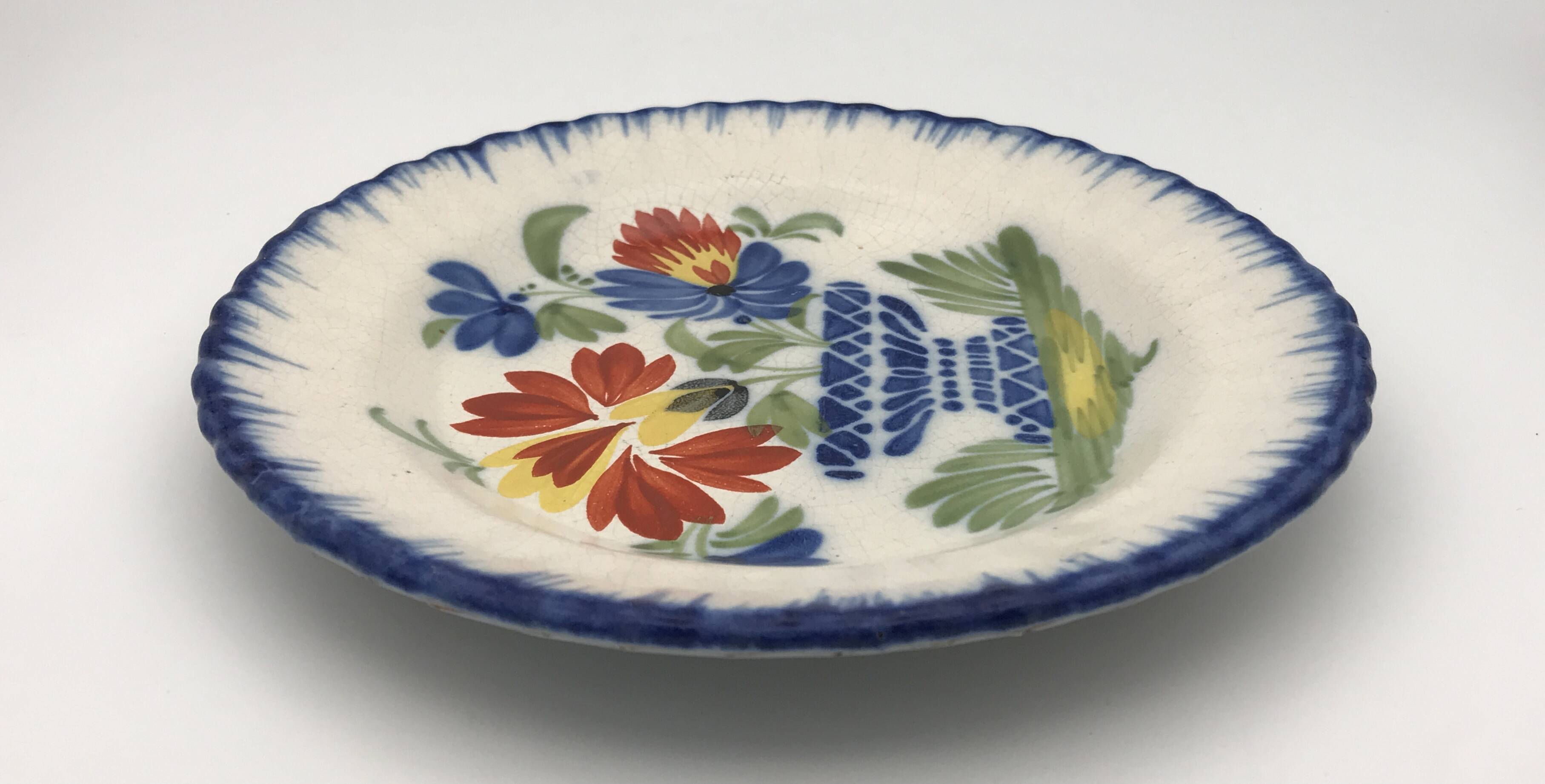 Antique auvillar earthenware plate decorated with basket of polychrome flowers