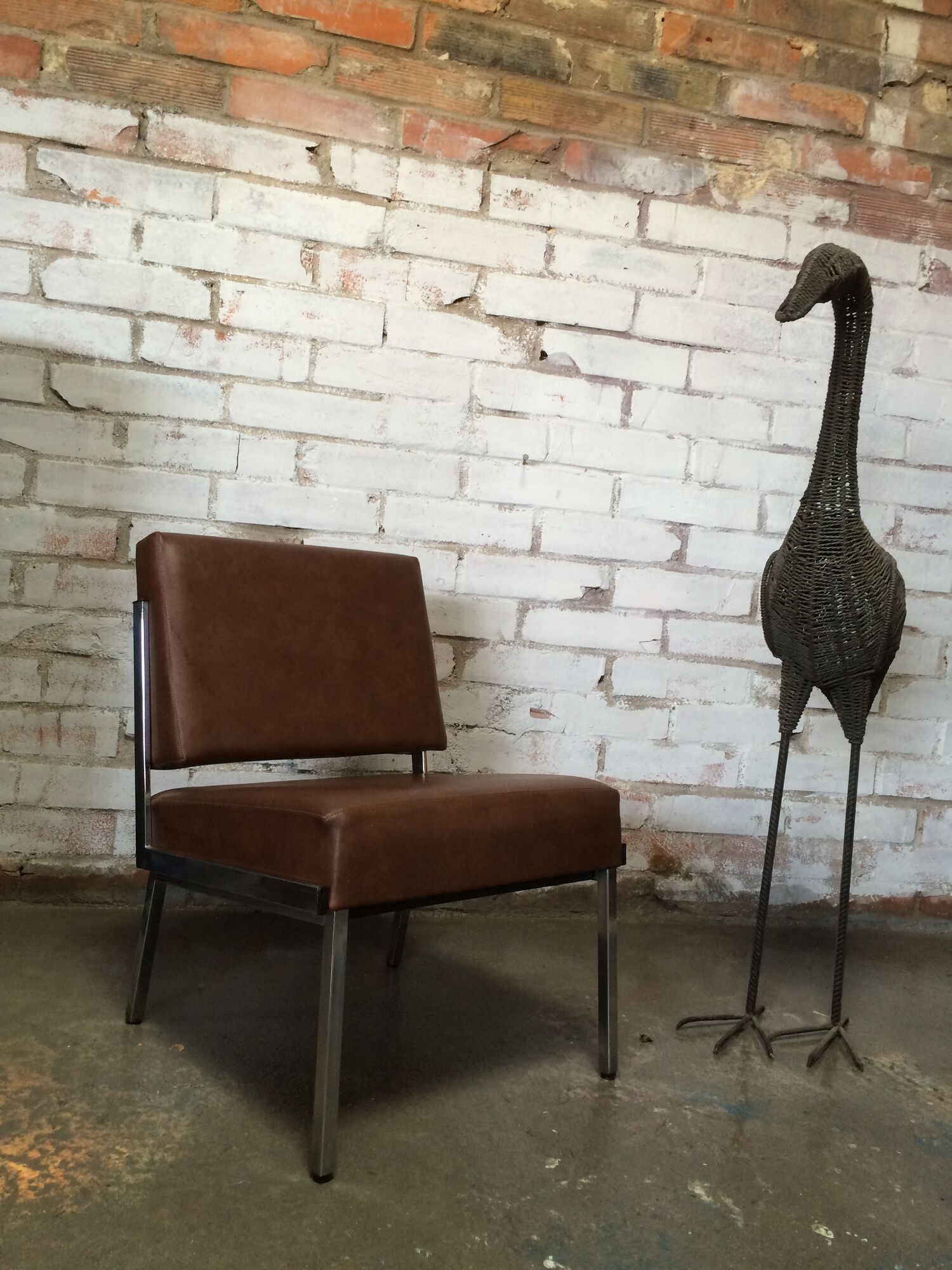 Modernist fireside chair / vintage chrome and skai armchair