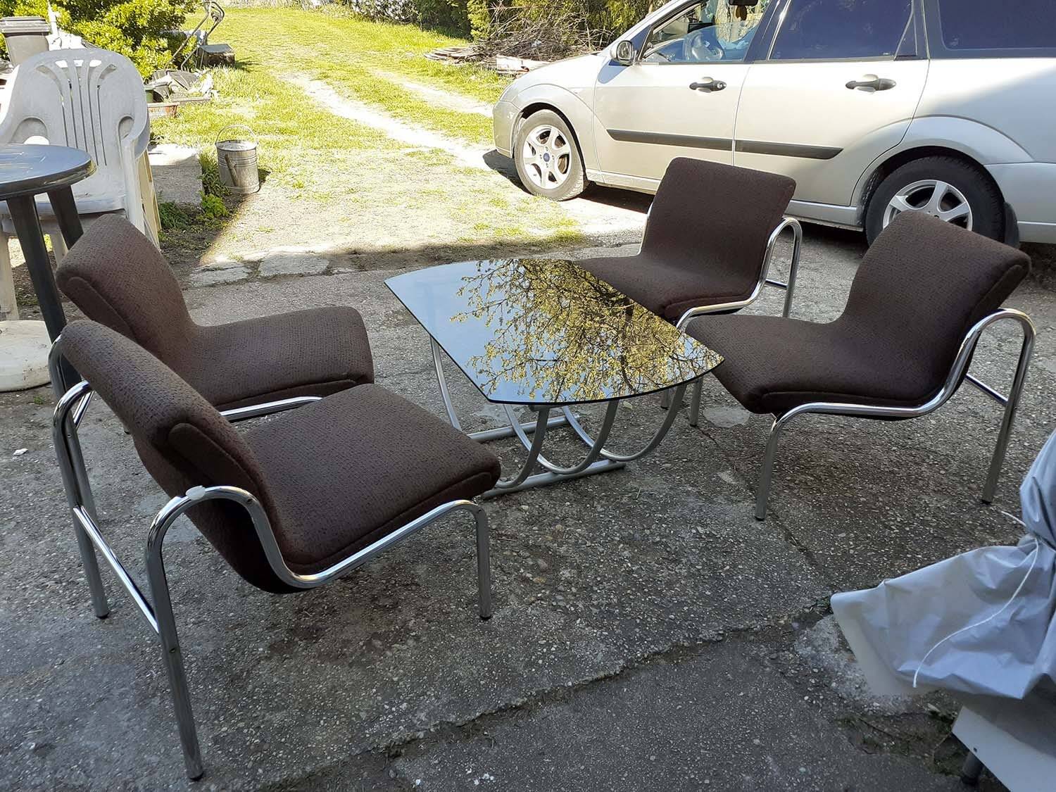 Table and 4 chairs in chrome metal with brown fabric and wood, Hungarian design from the 1960s.