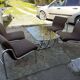 Table and 4 chairs in chrome metal with brown fabric and wood, Hungarian design from the 1960s.